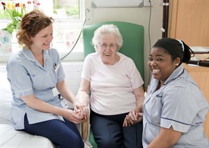 Nurses with elderley patient